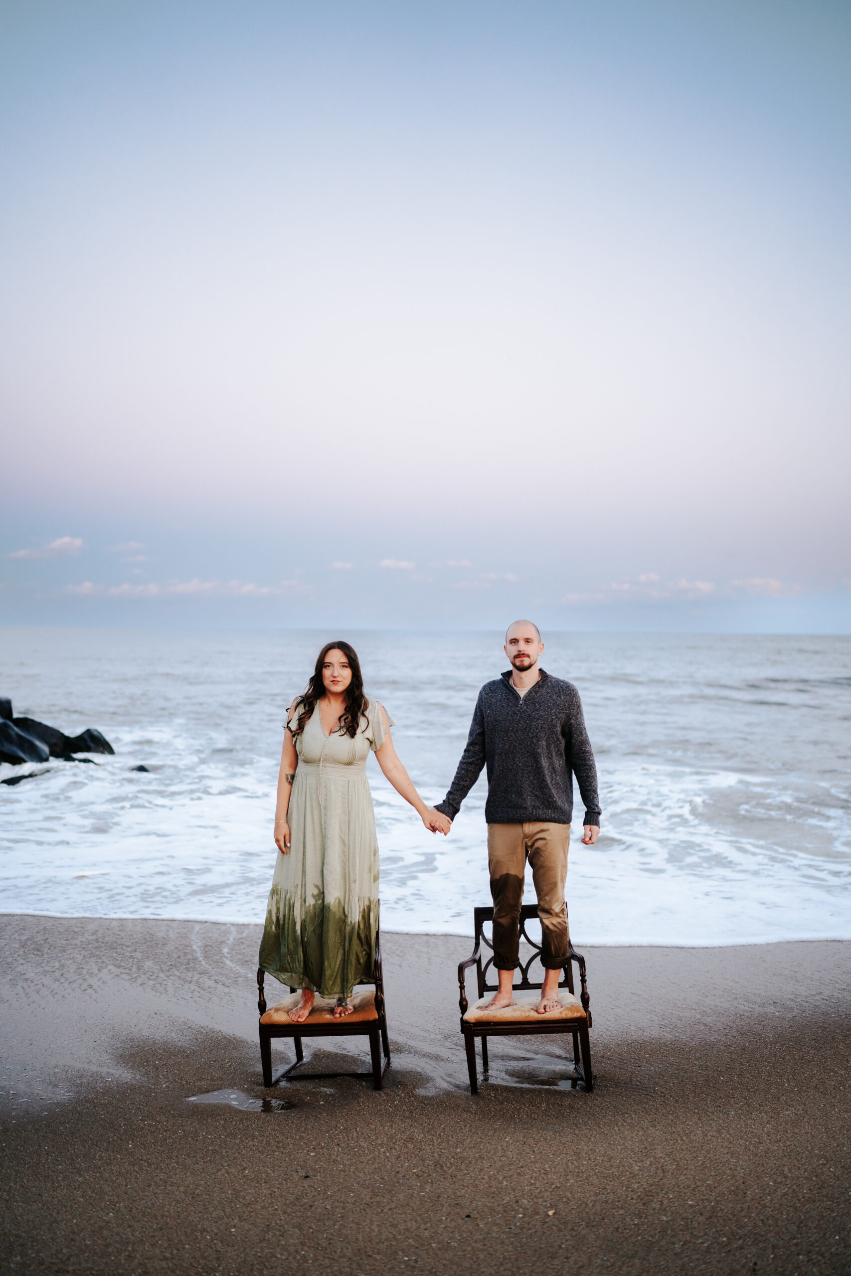 Fall Beach Engagement Photos Maryland Wedding Photographer unique chairs in ocean vibe in Asbury Park NJ