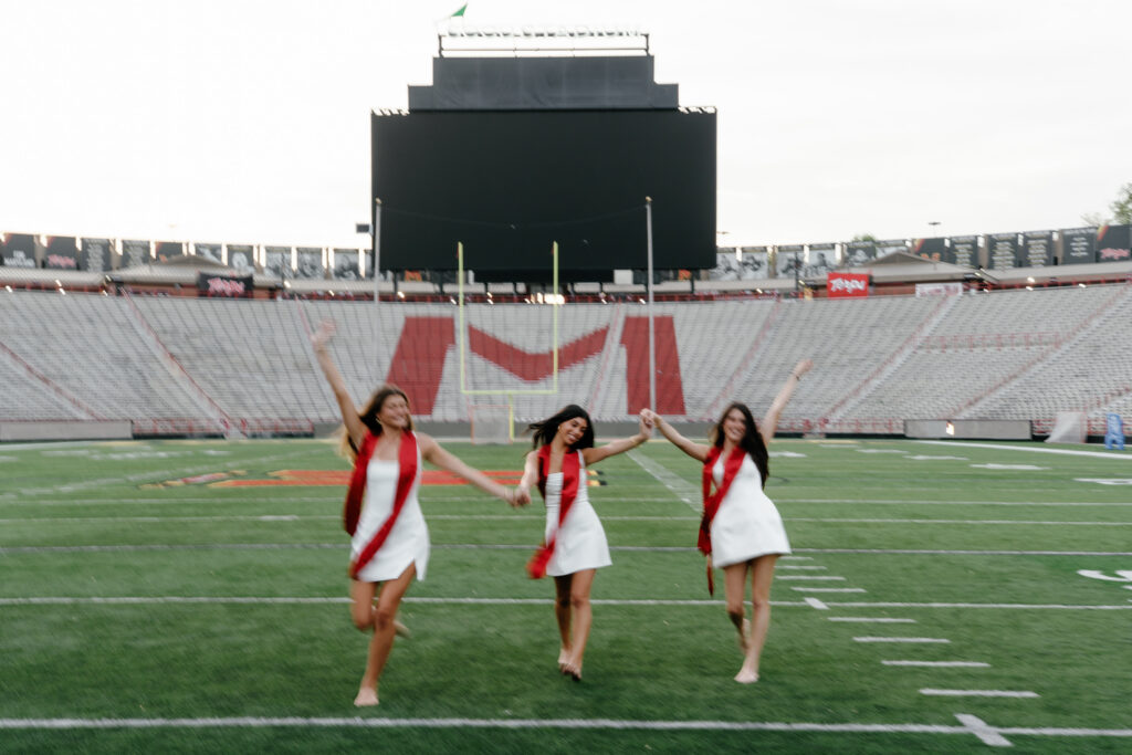 Motion blur slow shutter speed Graduation photos on SECU Stadium field at The University of Maryland