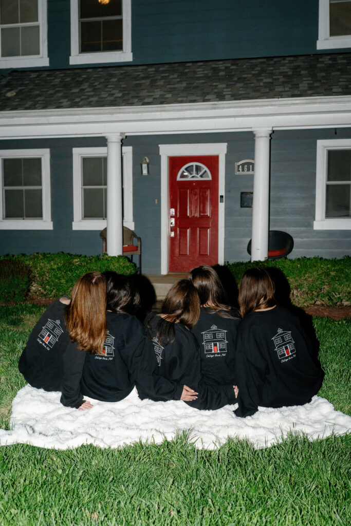 University of Maryland Seniors posing for one last photoshoot outside of their college house