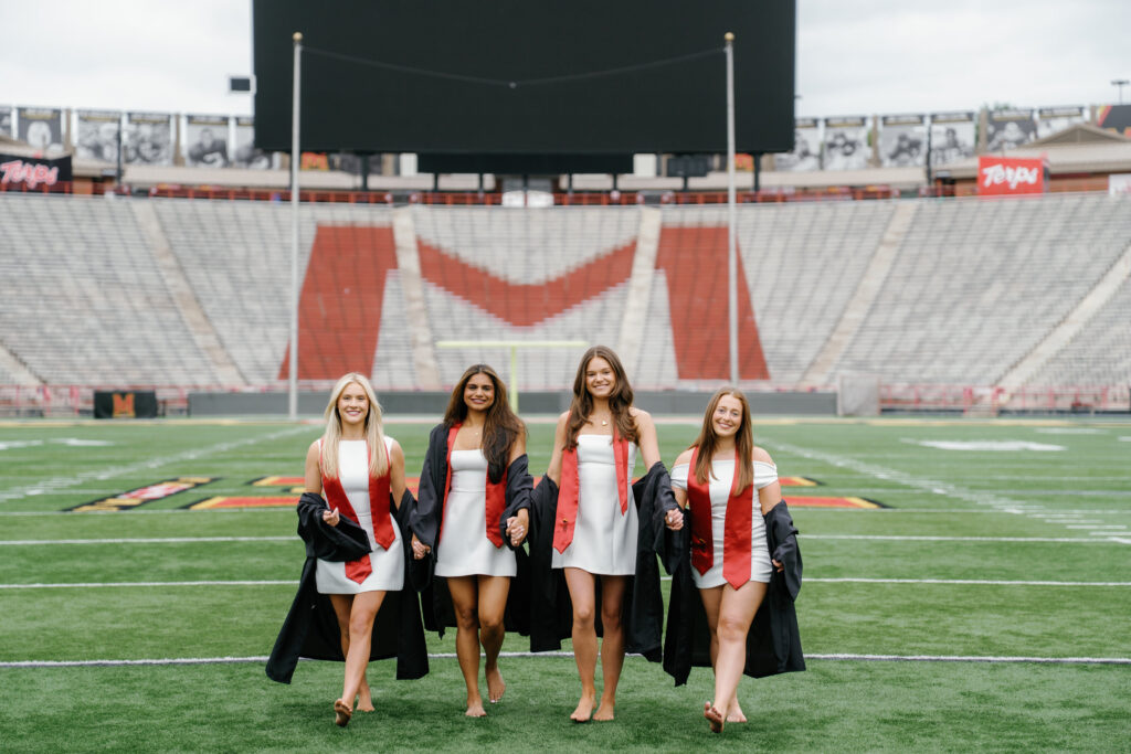 Graduation photos on SECU Stadium field at The University of Maryland